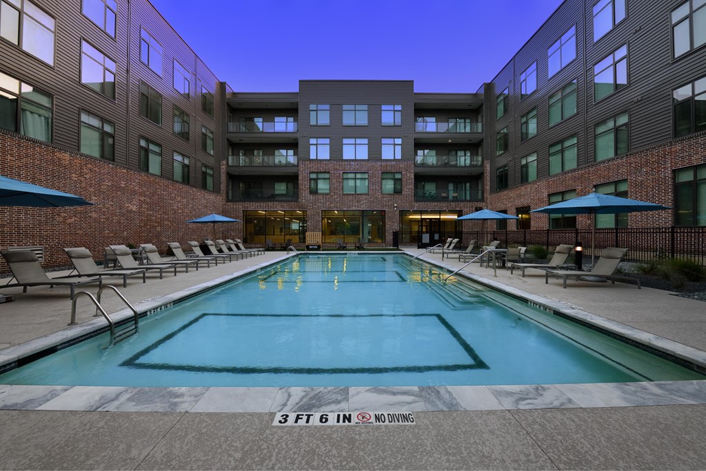 A large indoor swimming pool with no diving allowed.