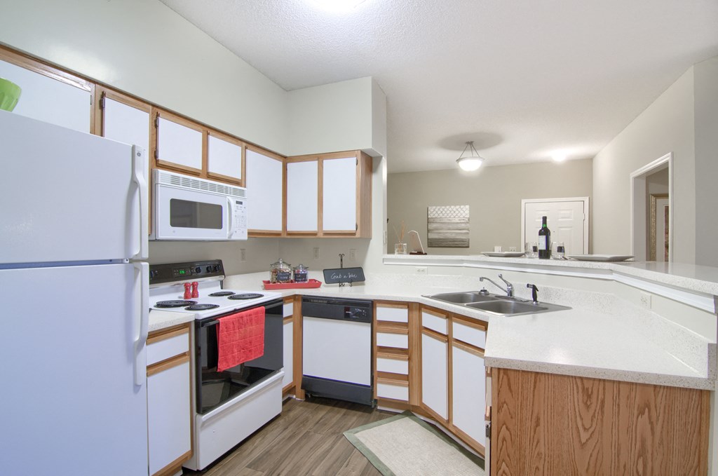 Enclave at Wolfchase Apartments in Cordova Tennessee photo of a kitchen with white cabinets and a white counter top