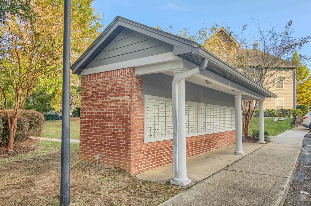 Twin Oaks Apartments in Hattiesburg Mississippi photo of a covered parking lot in front of a house