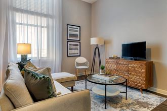 Living Room With TV Living Room With TV at Cosmopolitan Apartments, Saint Paul, MN, 55101