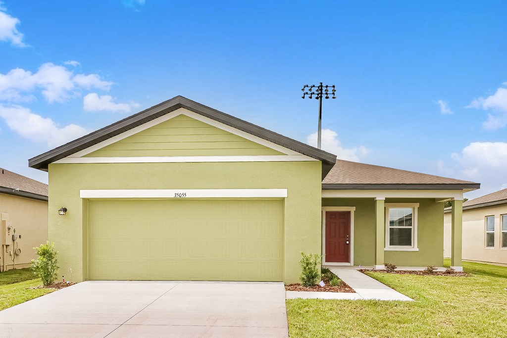 A house with a garage door that says "PICK" on it.