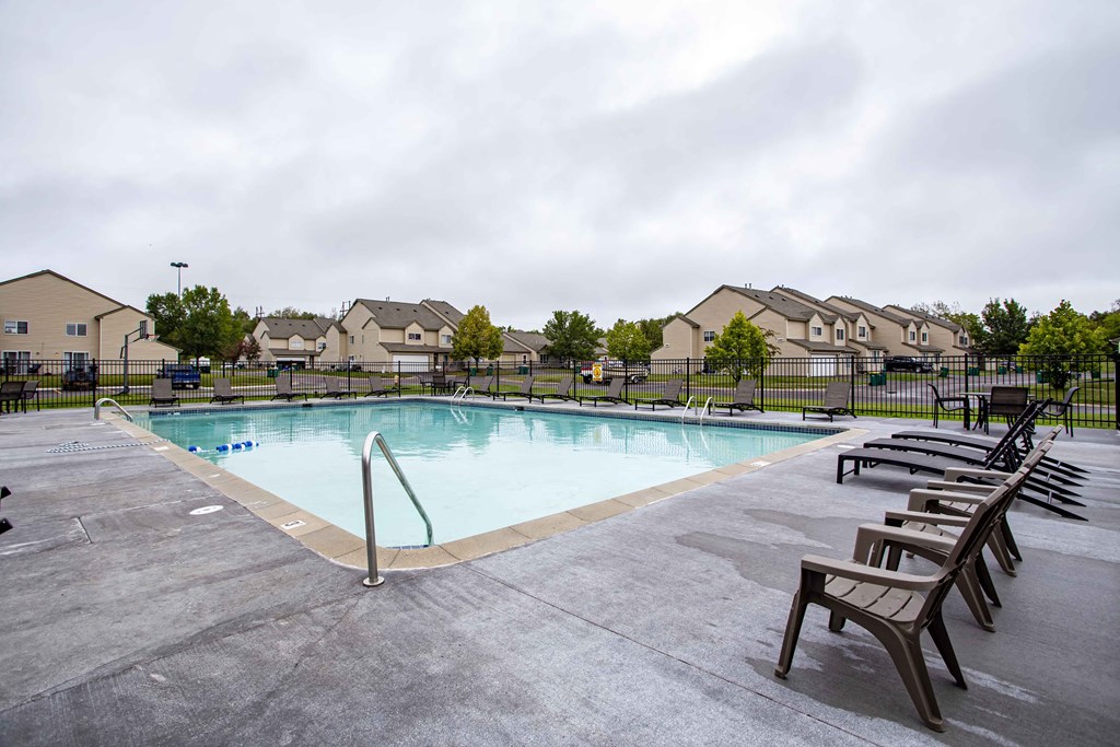 the swimming pool at the estates apartments
