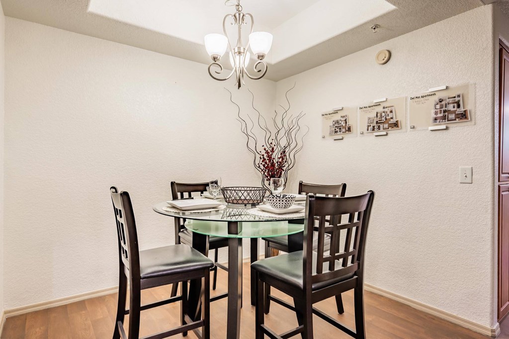 a dining room with a table and chairs
