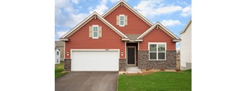 A red house with a white garage door.