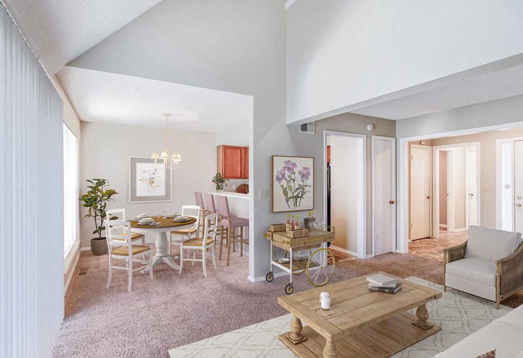 a living room and dining room with a table and chairs