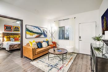 Hardwood vinyl plank flooring throughout living space, dining and bedrooms