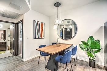 Designer lighting package including modern glass chandelier over dining space