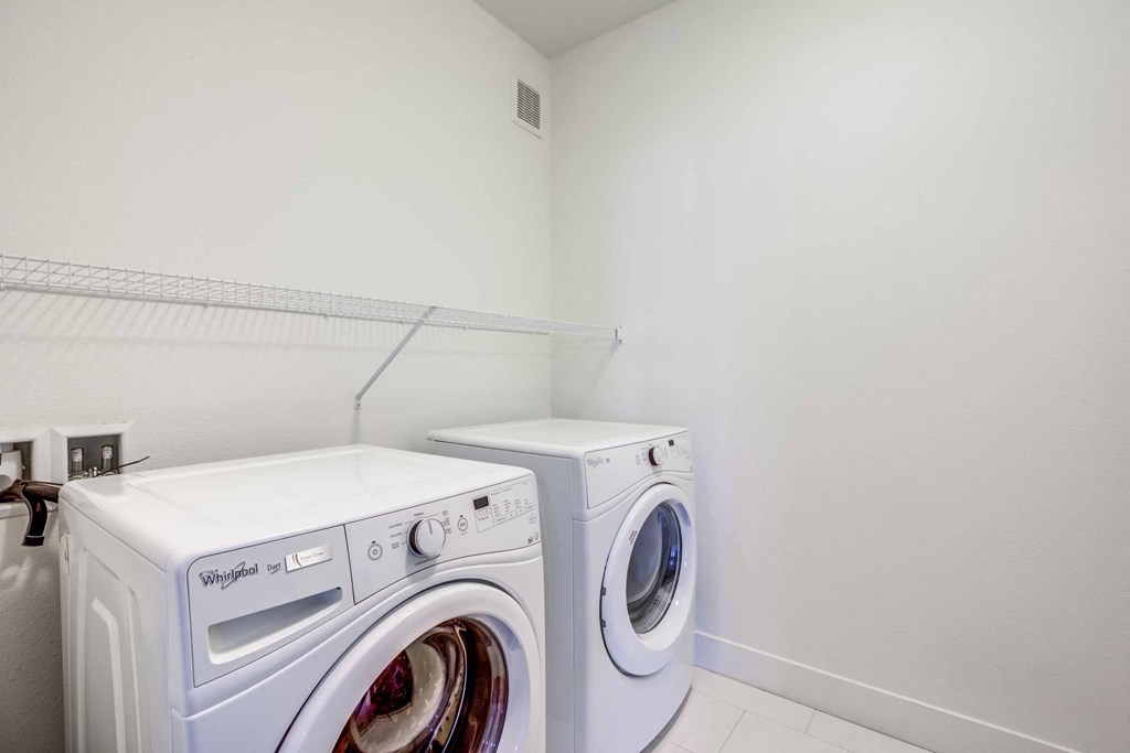 a laundry room with a washing machine and a dryer