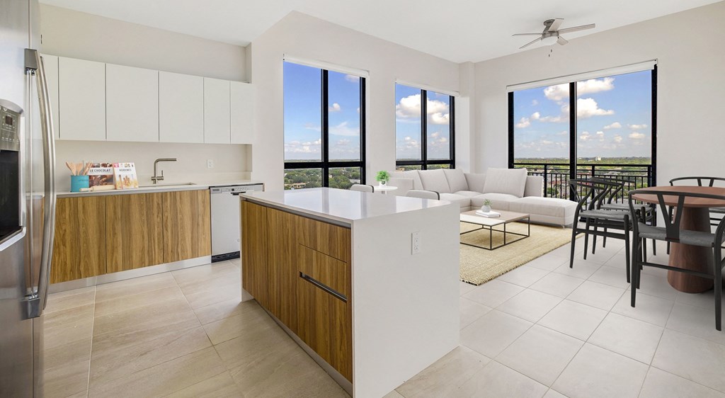 a kitchen and living room with a couch and a table