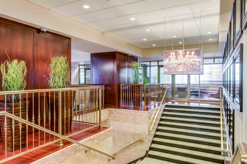 Main entrance doors and stairs with crystal chandelier