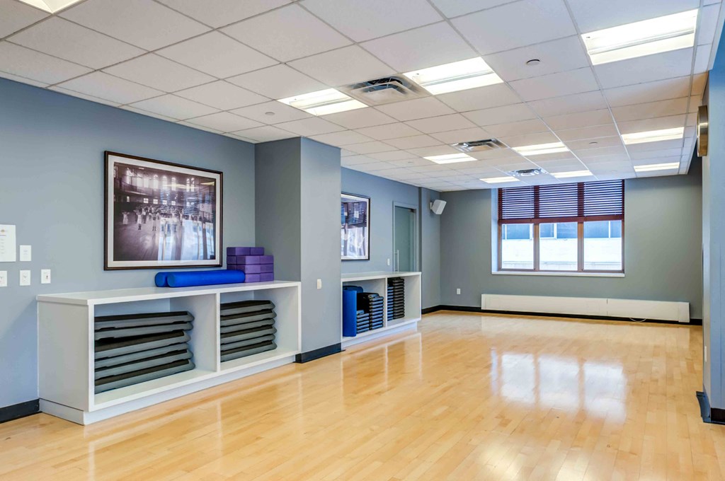 Yoga studio with polished birch flooring and loaner mats
