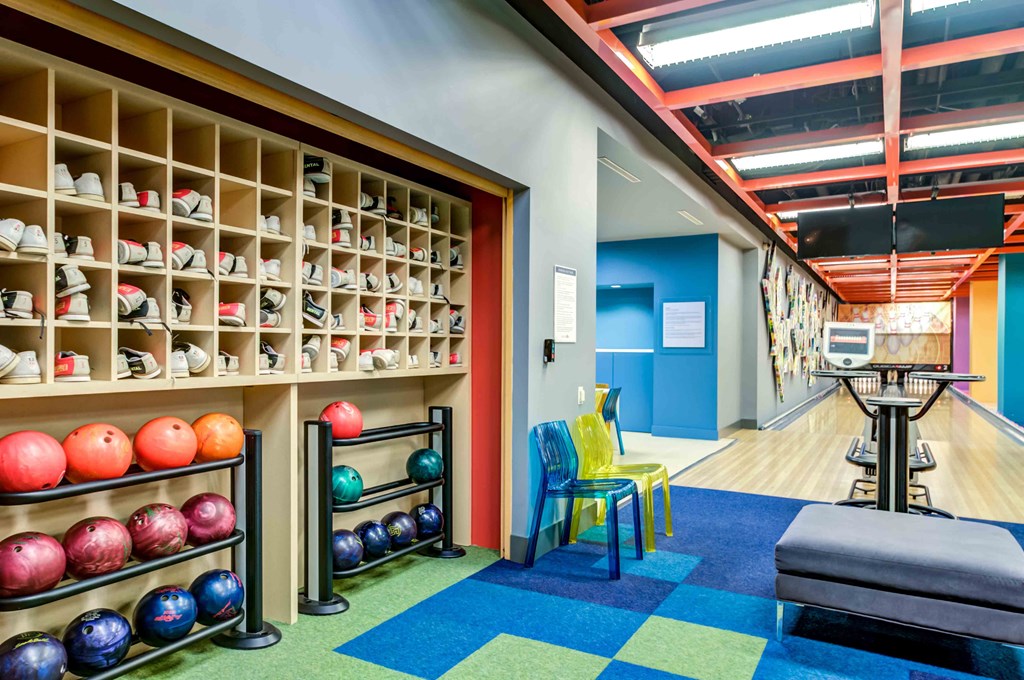 Bowling shoes and bowling balls in bowling alley
