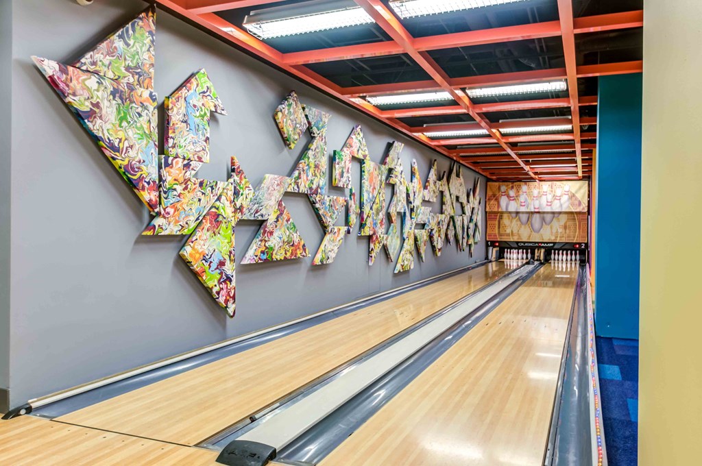 Bowling alley with art installation on wall
