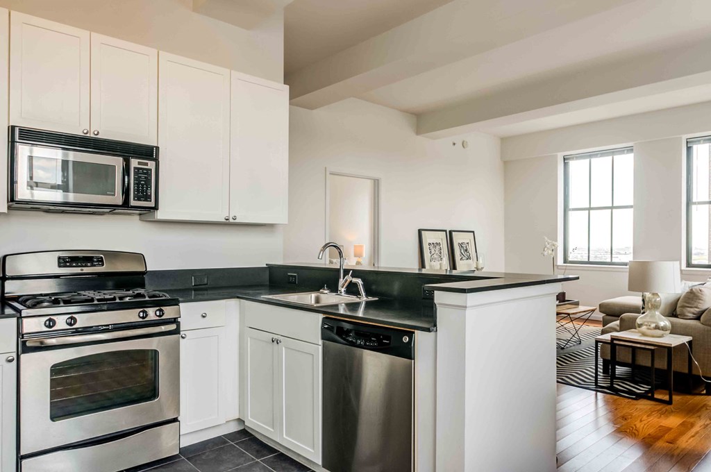 Kitchen with white cabinets and stainless appliances