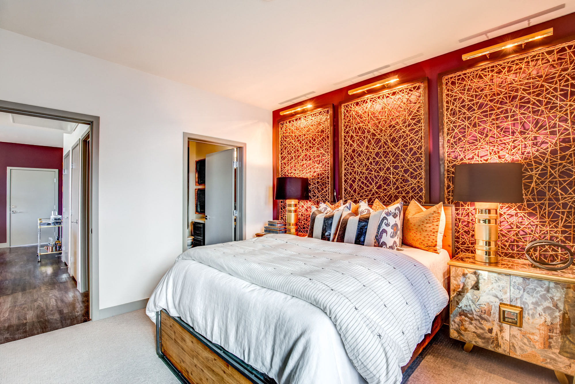 a bedroom with a large bed and a large window