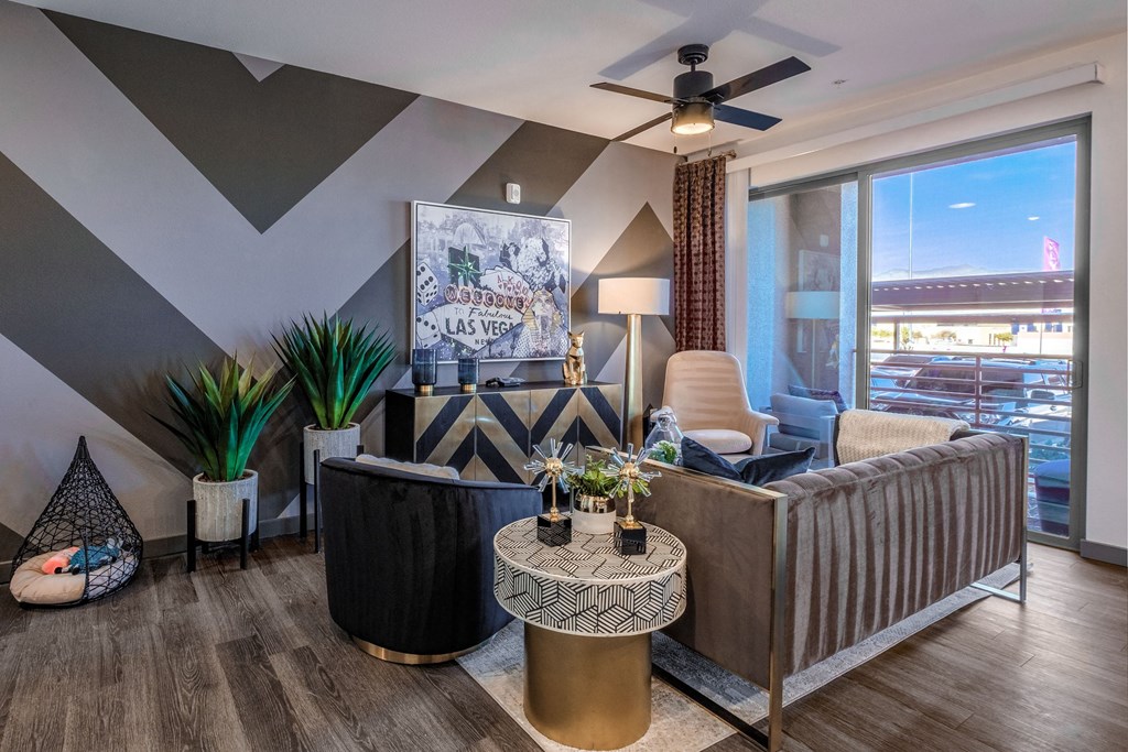 a living room with a couch and a ceiling fan