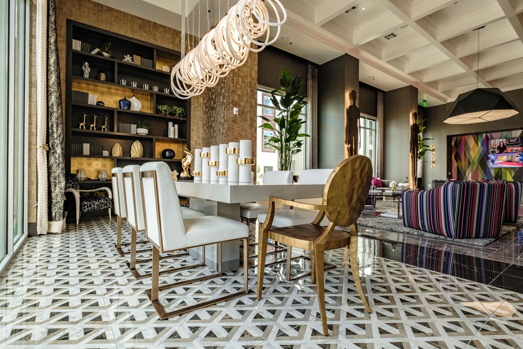 a dining room with a white table and chairs