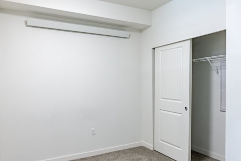 A white door is open to a hallway at Emerald Crest, WA, 98011