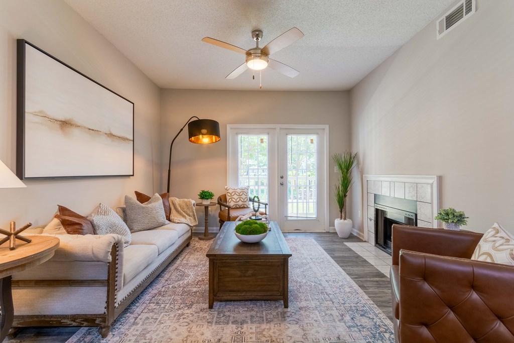 Spacious living room with modern finishes at Enclave at Wolfchase Apartments in Cordova, TN – pet-friendly 1, 2, and 3-bedroom apartments for rent.
