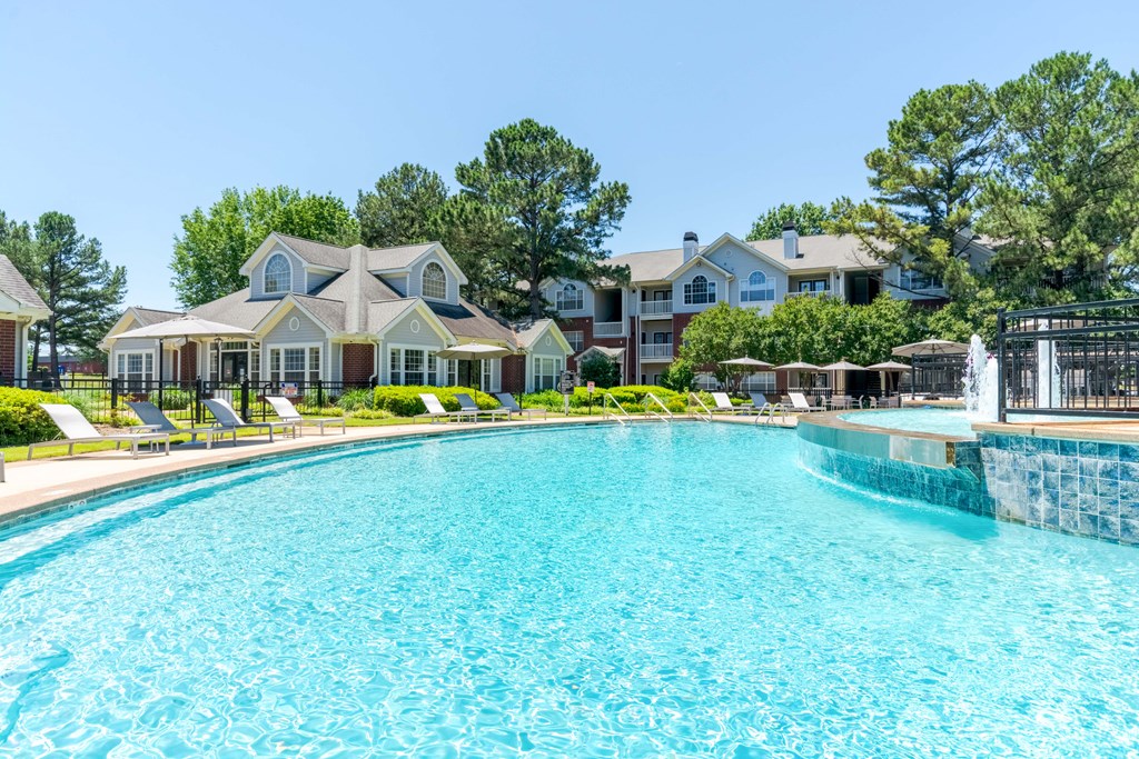 Large pool with spacious deck seating at Enclave at Wolfchase – apartments in Cordova, TN with luxury amenities.