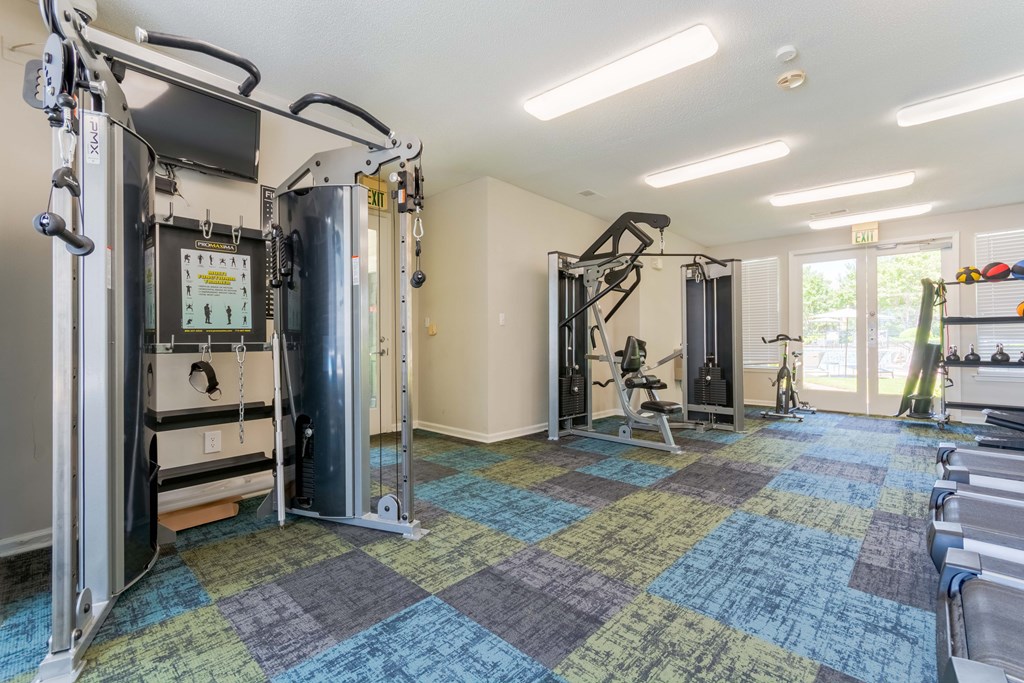 Strength training equipment in fitness center at Enclave at Wolfchase in Cordova, TN.