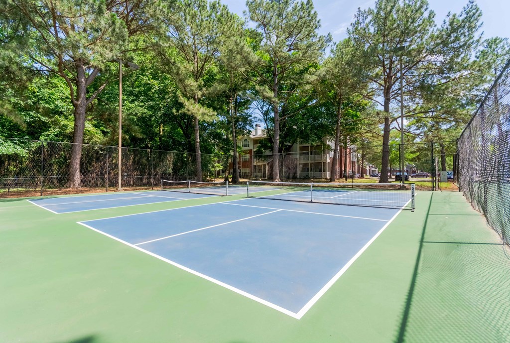 Outdoor tennis court for residents at Enclave at Wolfchase Apartments near Memphis, TN.