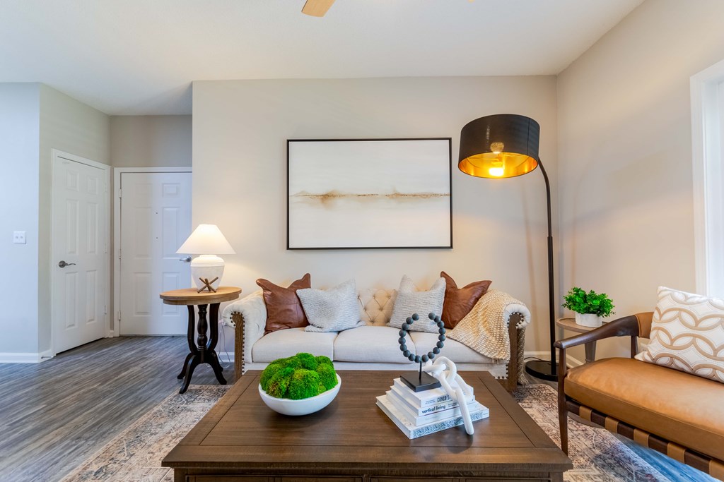 Spacious living room with modern finishes at Enclave at Wolfchase Apartments in Cordova, TN – pet-friendly 1, 2, and 3-bedroom apartments for rent.