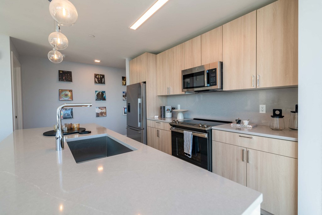 a kitchen with a large counter top and a sink