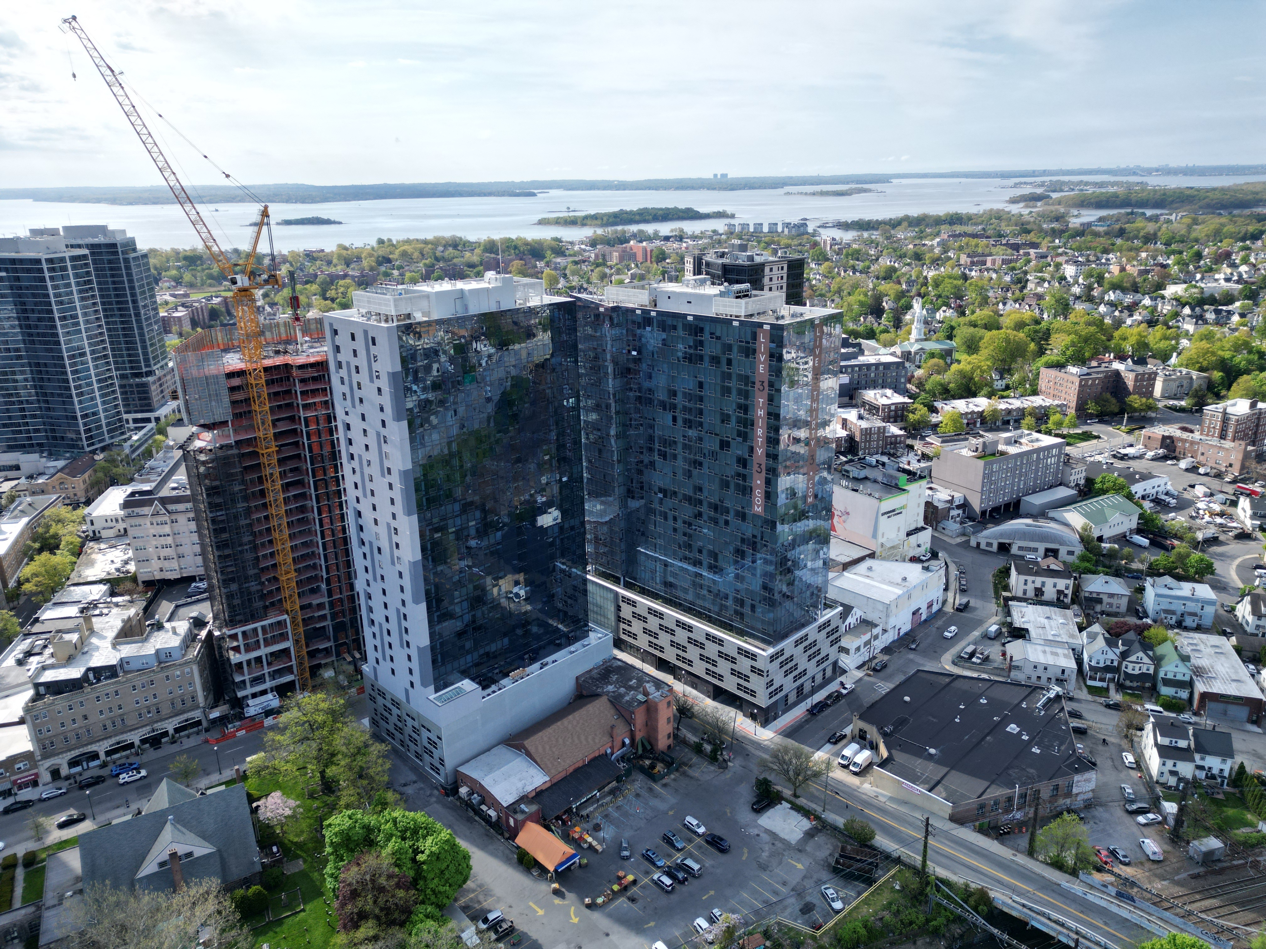 an aerial view of a tall building in the city