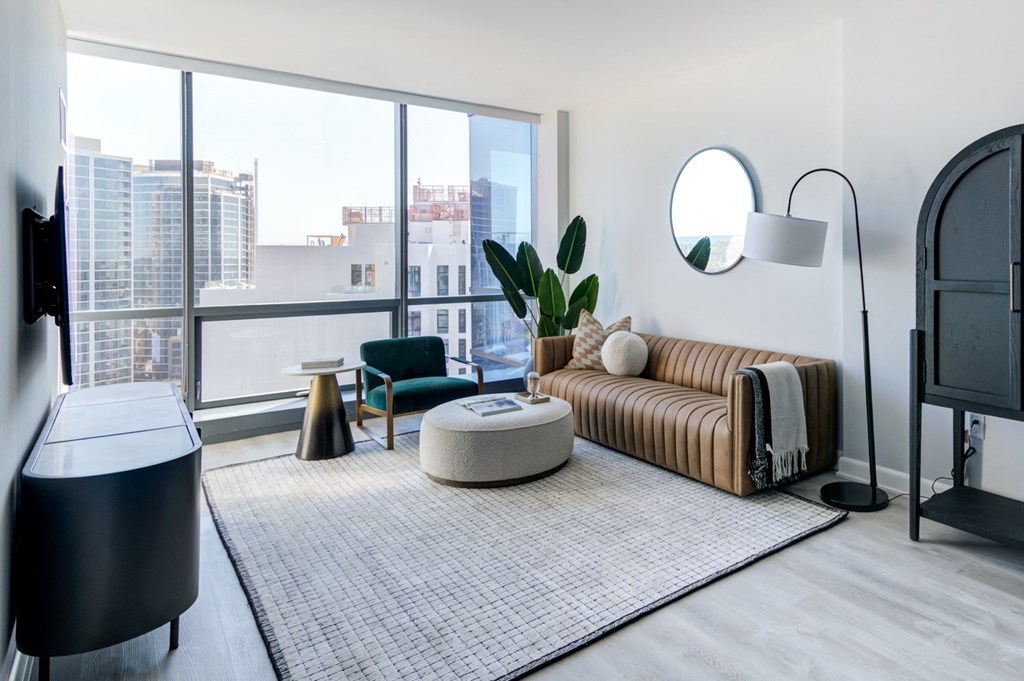 a living room with a couch and a large window