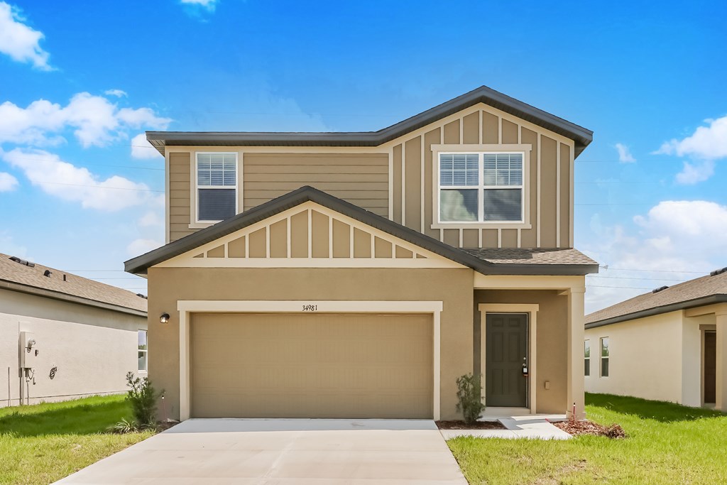 A two-story house with a garage is shown.