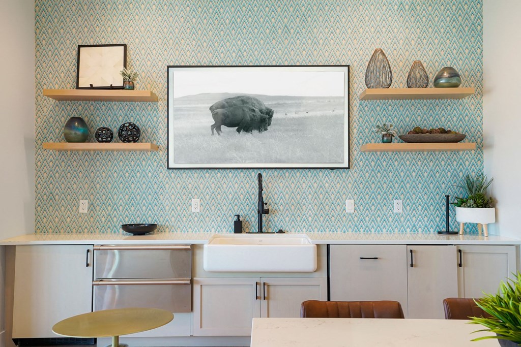 the frame on the wall above a kitchen counter displaying a black and white picture