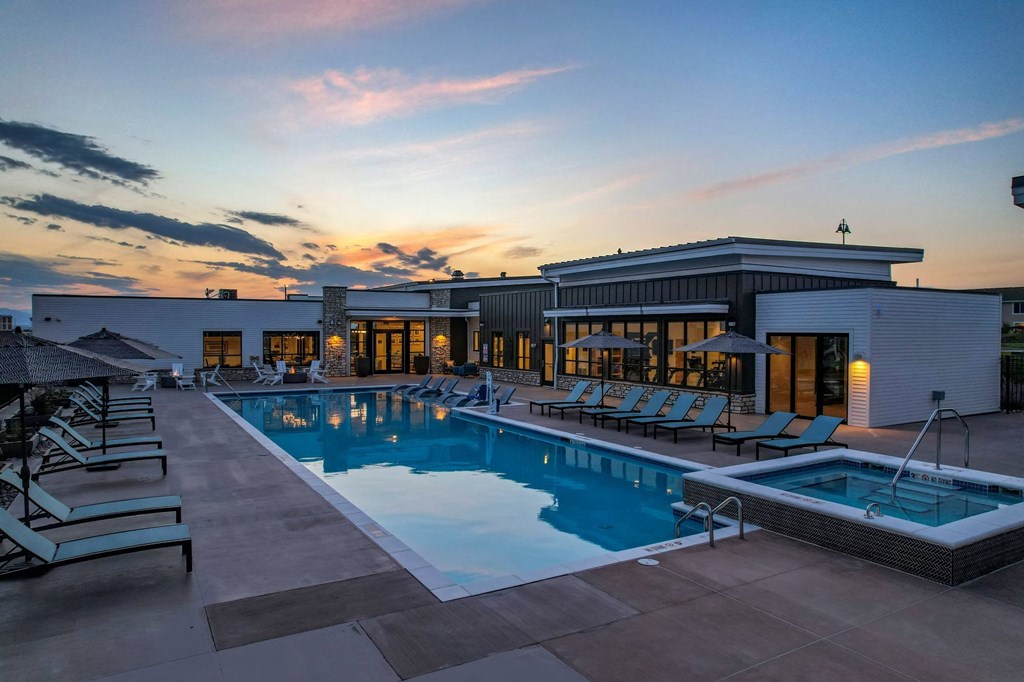 a swimming pool at the resort at dusk