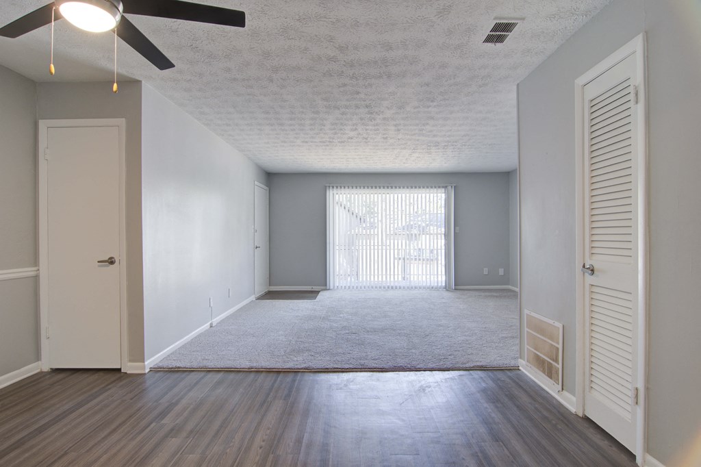 Spacious living room with large window and natural light at pet-friendly Estuary apartments in Atlanta, GA 30341, near Chamblee and Brookhaven.