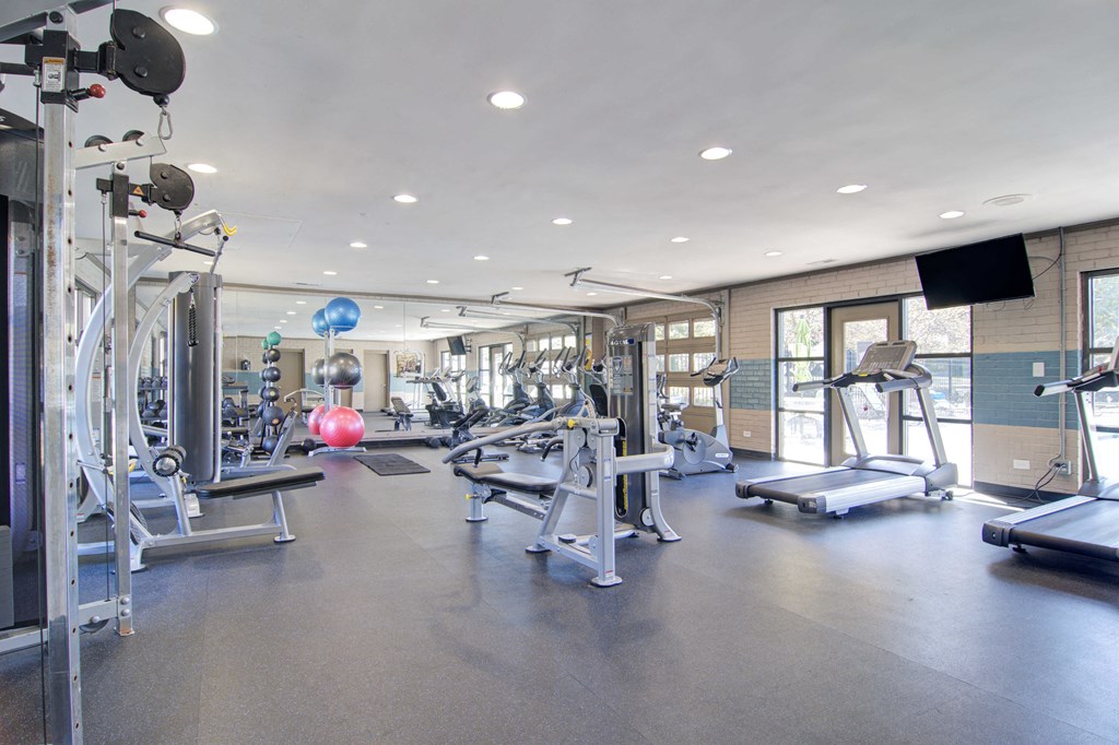 Fully equipped fitness center with modern exercise machines at Estuary apartments in Atlanta, GA 30341, near Chamblee and Brookhaven.