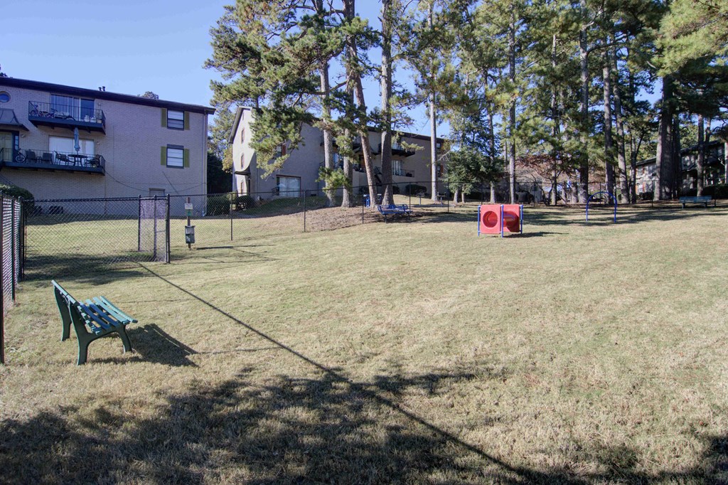 Fenced dog park with agility features at pet-friendly Estuary apartments in Atlanta, GA 30341, near Chamblee and Brookhaven.