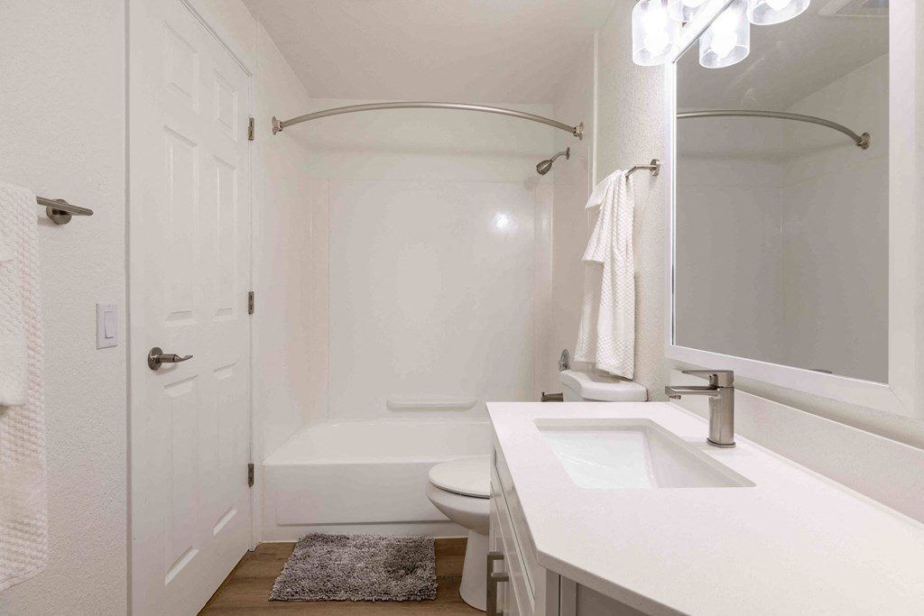 a bathroom with a sink toilet and bathtub