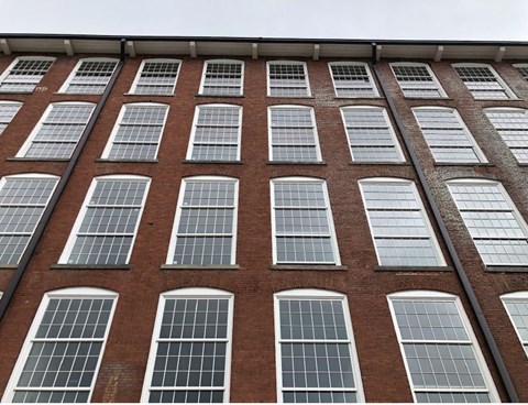 a large brick building with many windows