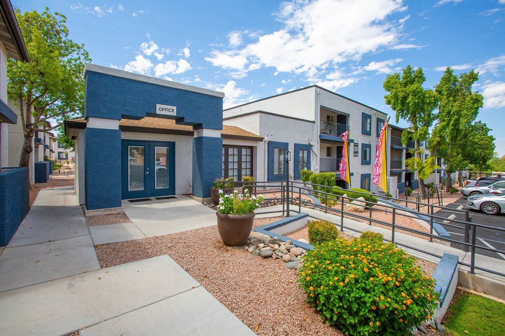a street view of a building with stairs and a sidewalk