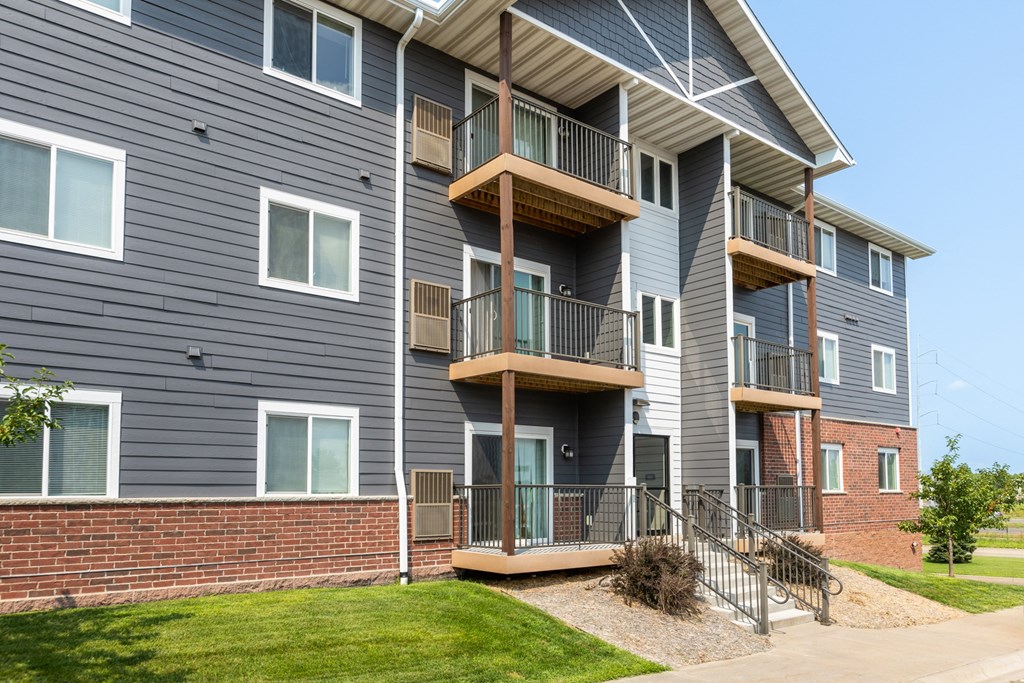 an apartment building and a brick wall