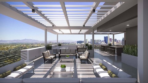 Las Vegas, NV, Modern Apartments Near Harry Reid International Airport - Prosper 150 - Sky Deck With Pergola Shade, Lounge Seating, Dining Tables, and Views of the Las Vegas Skyline.