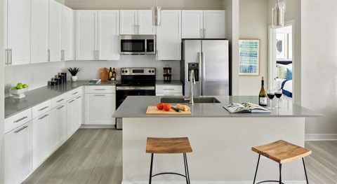 a kitchen with a counter top and a sink