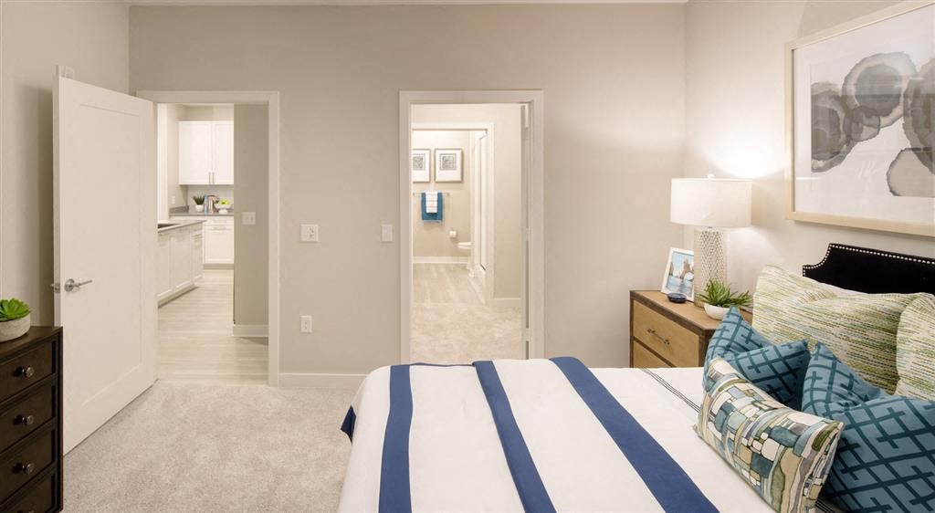 Bedroom interior with views to kitchen and bathroom.