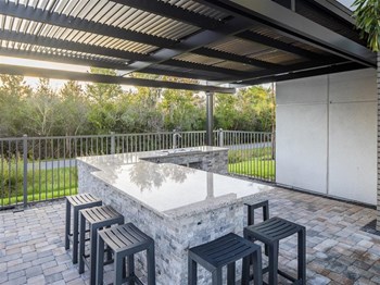 Icaria on Pinellas apartments in Tarpon Springs, FL photo of outdoor eating area - Photo Gallery 26