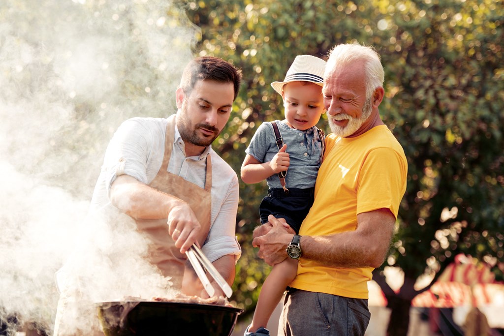 Family outside grilling