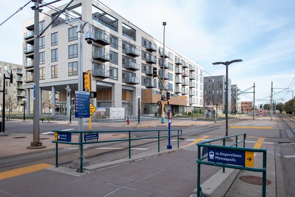 A street view of a city with a sign that reads