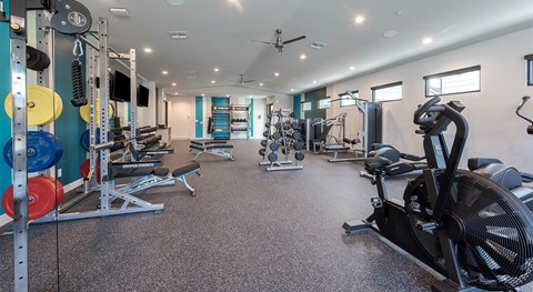 Fully Furnished Townhomes for Rent in North Phoenix, AZ - Bloom at Deer Valley - Fitness Center With Weight Machines, Dumbbell Racks, Cardio Equipment, and Ceiling Fans.