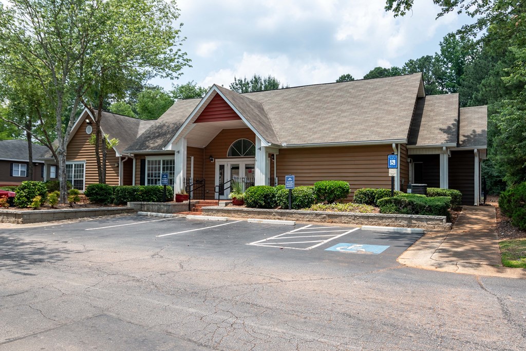 Exterior view of the leasing office building at Flats at River View apartments in Duluth, GA, near Lawrenceville.