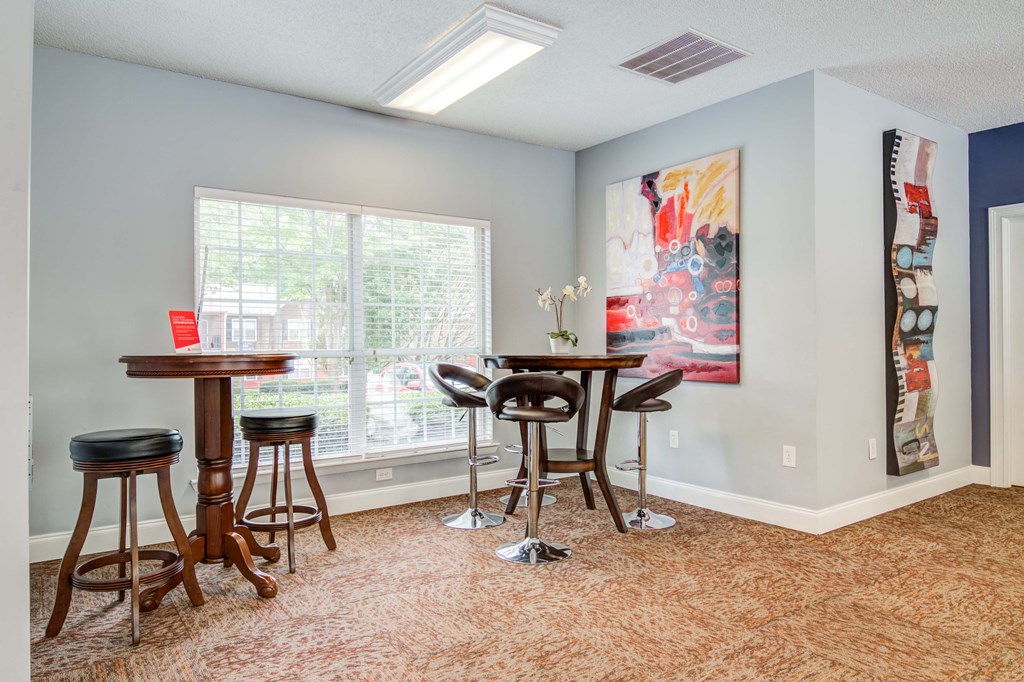 “Resident clubhouse with lounge and social spaces at Flats at River View apartments in Duluth, GA, near Lawrenceville.