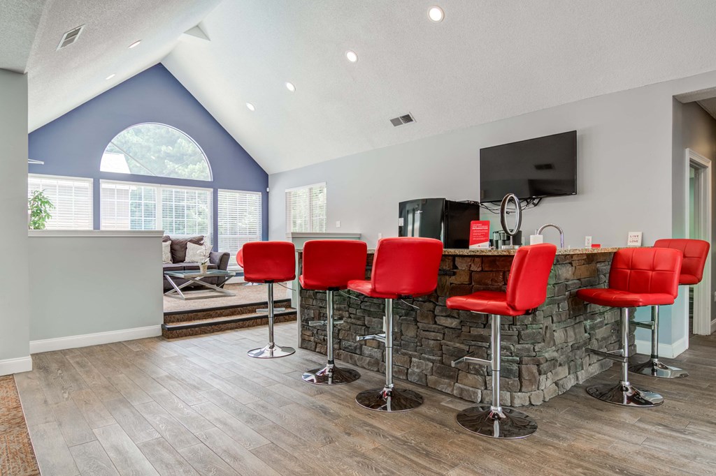 Spacious clubhouse with comfortable seating and community amenities at Flats at River View apartments in Duluth, GA, near Lawrenceville.